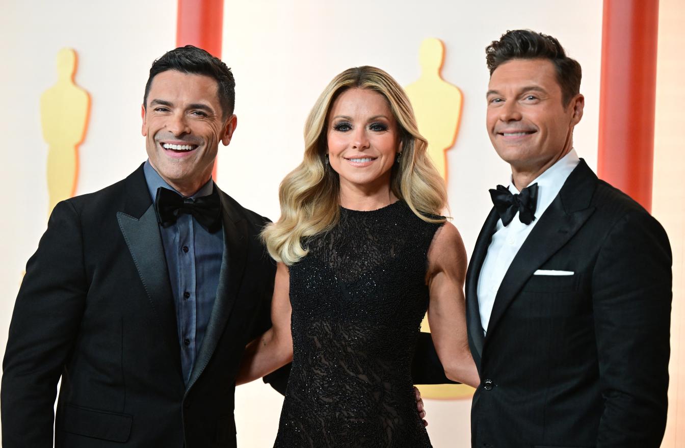 Actor Mark Consuelos, TV host Kelly Ripa and Ryan Seacrest (R) attend the 95th Annual Academy Awards at the Dolby Theatre in Hollywood