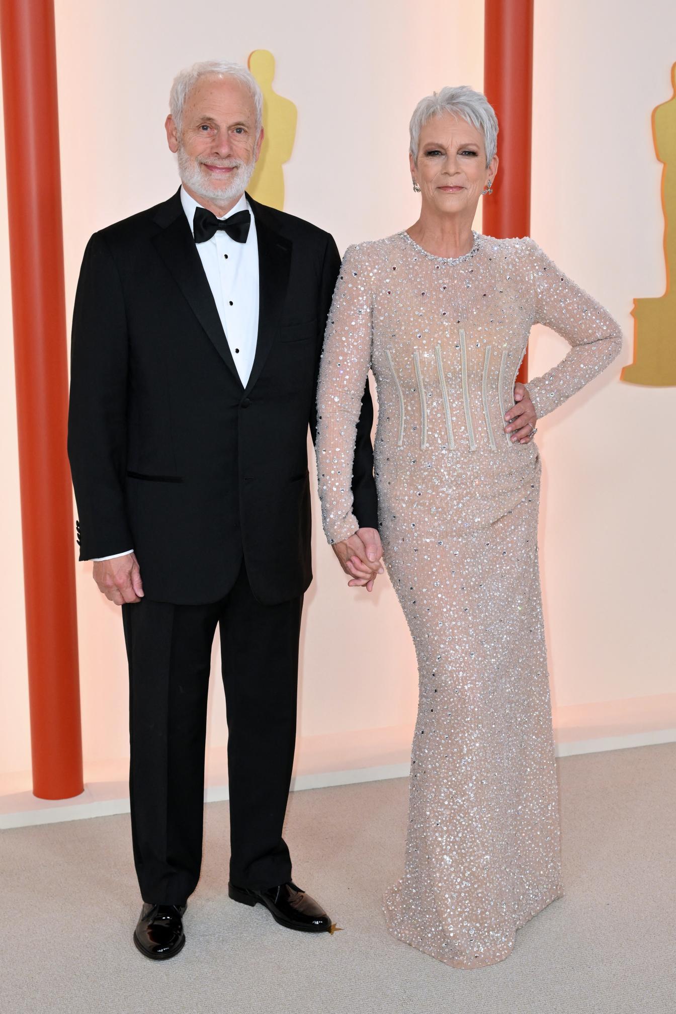US actress Jamie Lee Curtis and husband Christopher Guest attend the 95th Annual Academy Awards at the Dolby Theatre in Hollywood